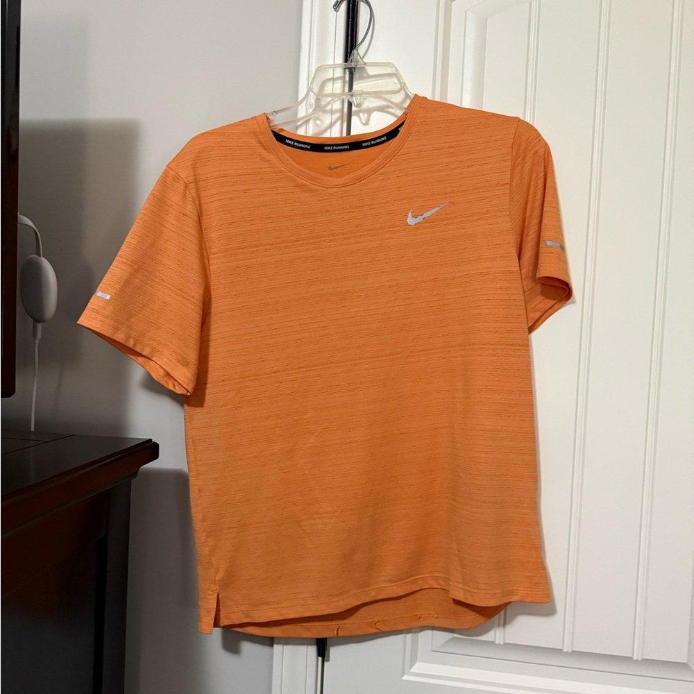 Nike dry fit running shirt. Size small color peach